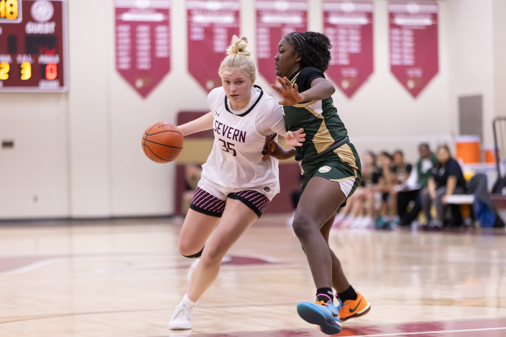 Severnâs Val Waugh drives to the basket against Ofundem Mbelem...