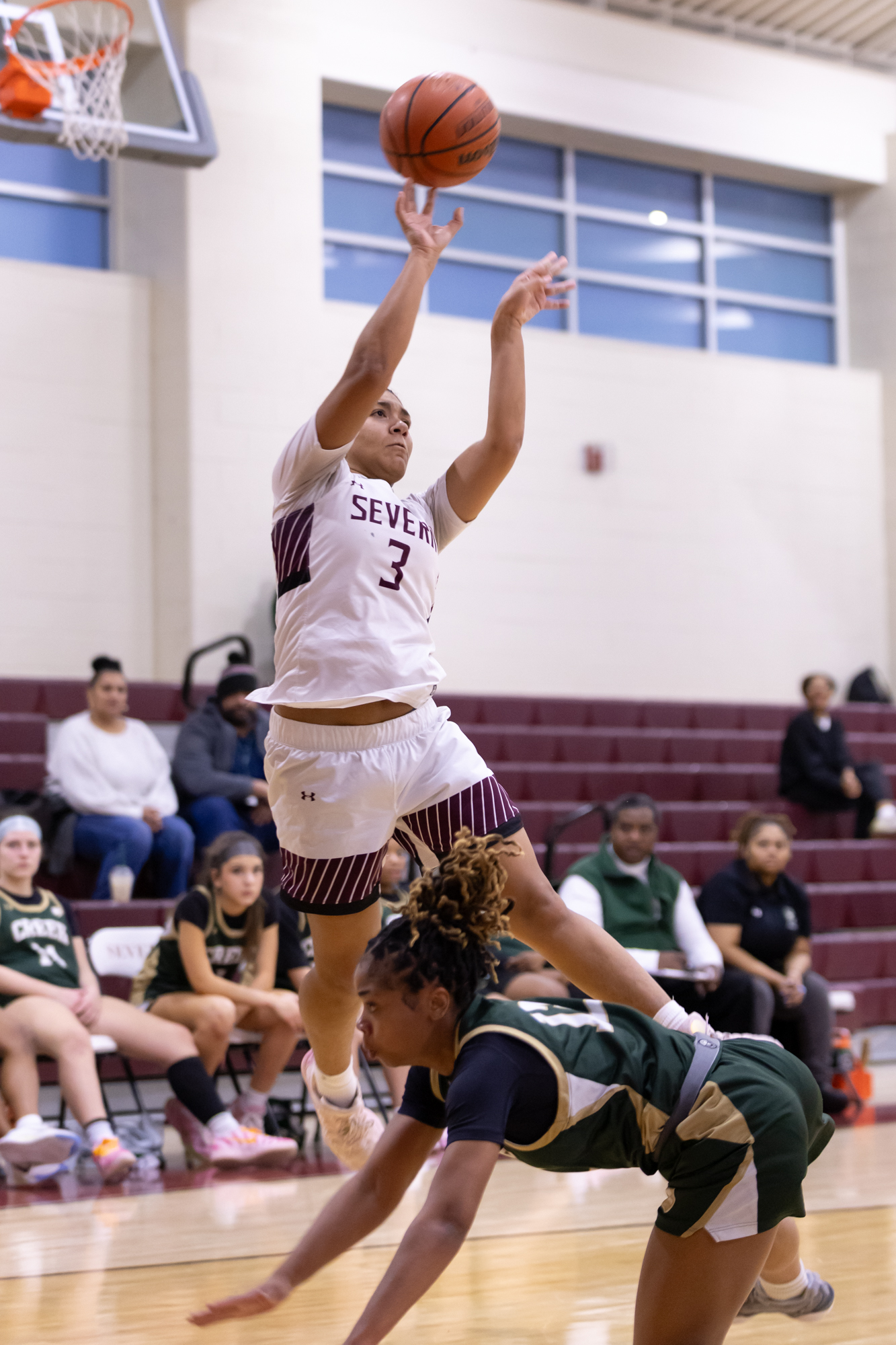 Severnâs Layla Epps puts up a shot over Norah Young...