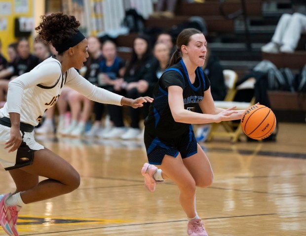 Burlington Central's Audrey LaFleur (5) drives past Jacobs' Zara Lewis (10) during their game at Jacobs High School in Algonquin on Wednesday, February 11, 2026. (Ryan Rayburn/for the Aurora Beacon News)