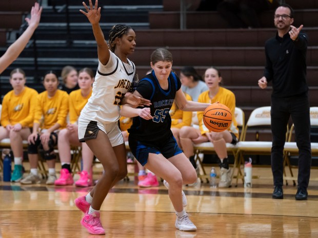 Burlington Central's Scarlett LaFleur (55) pushes past Jacobs' Bri Ramsey (22) during their game at Jacobs High School in Algonquin on Wednesday, February 11, 2026. (Ryan Rayburn/for the Aurora Beacon News)