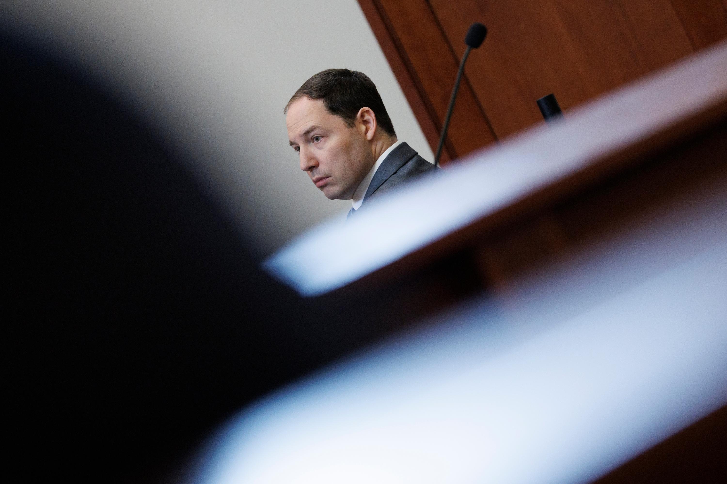 Brendan Banfield looks on during the double murder trial for...