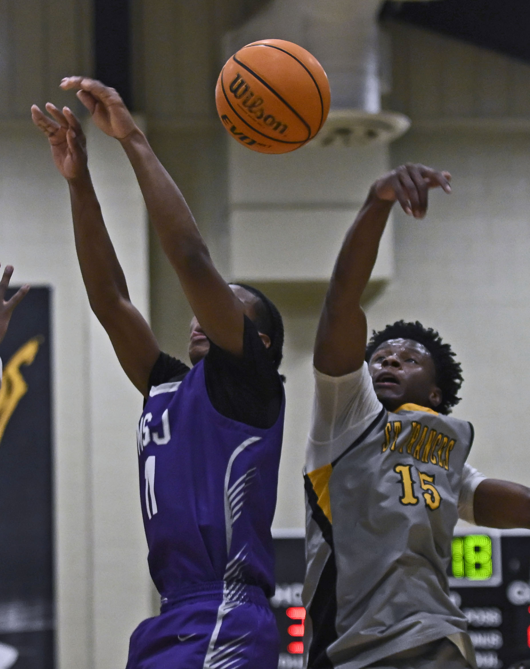 St. Francesâ Anthony Smith, right, blocks a shot by Mount...