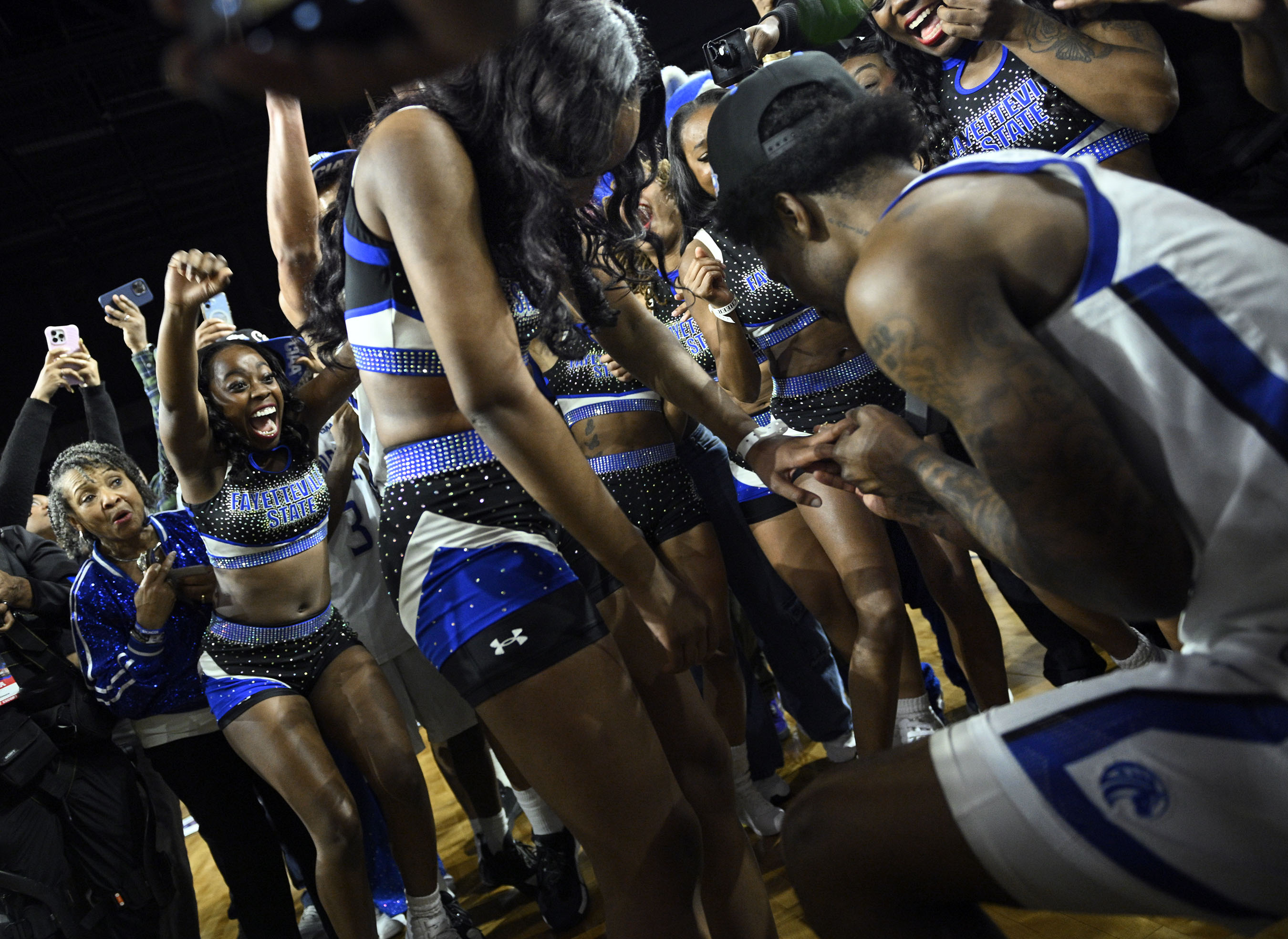 Fayetteville Stateâs Ezekiel Cannedy, right, puts the ring on girl...