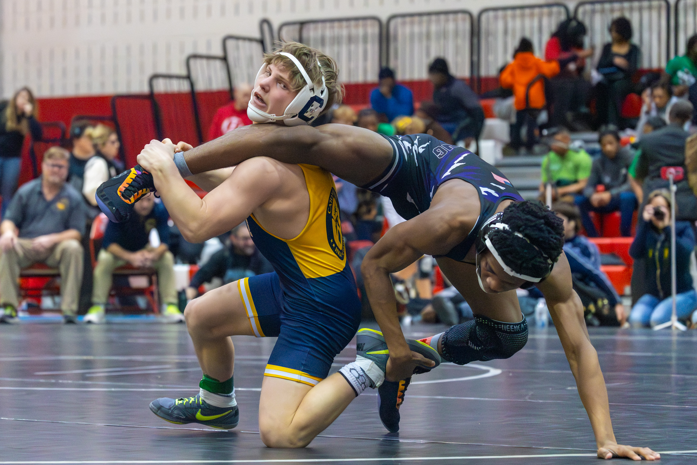 Catonsville's Drew Eveleth and Meade's Jalni Lewin fight for dominance...