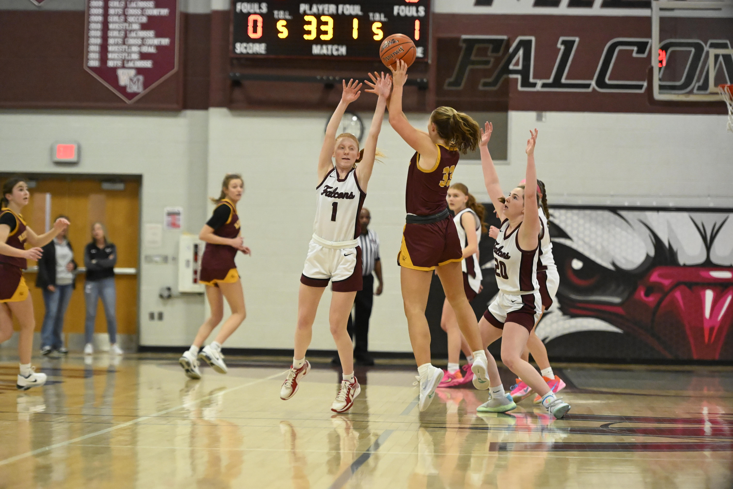 Hannah Neske stretches to block a pass by Herfordâs Grace...