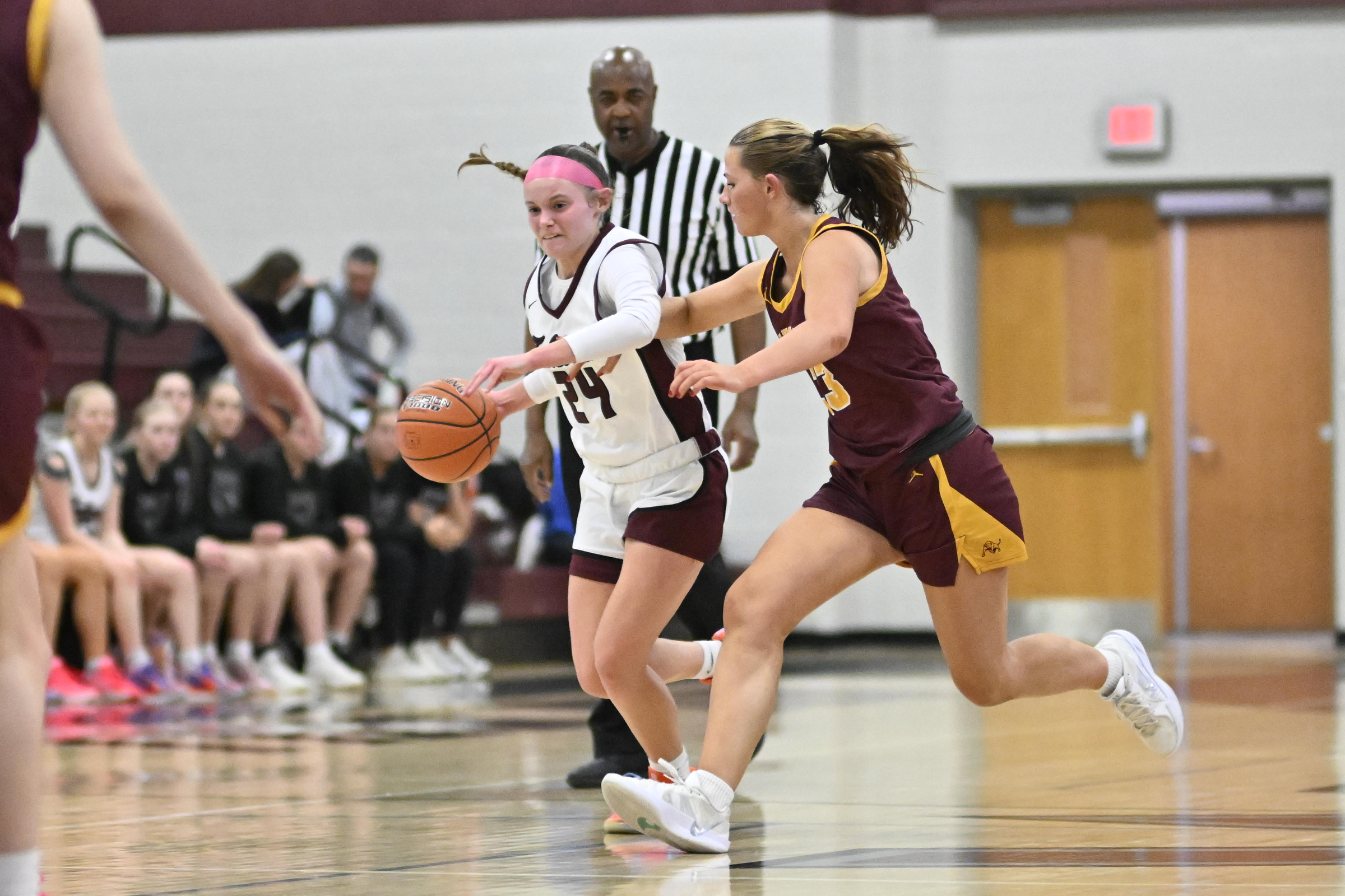 Riley Hollinger drives past Herfordâs Grace OâReilly during a playoff...
