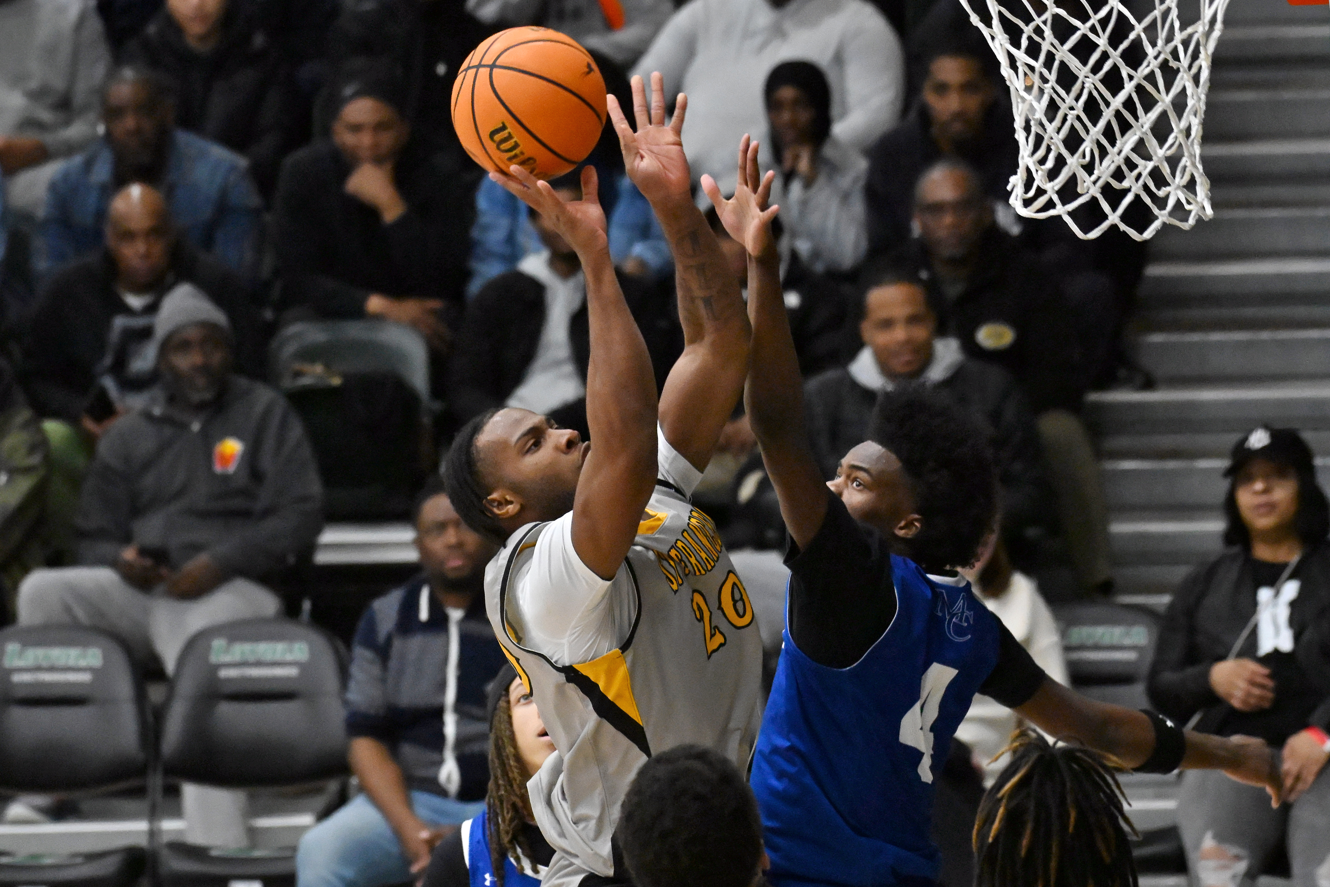 St. Frances' James Branch takes a shot over Mount Carmel's...