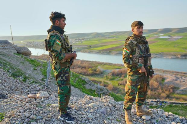 Members of the Kurdistan Freedom Party PAK stand guard in Irbil, Iraq, Thursday, March 5, 2026. (AP Photo/Rashid Yahya)