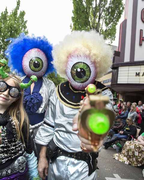 people dressed as aliens at a parade