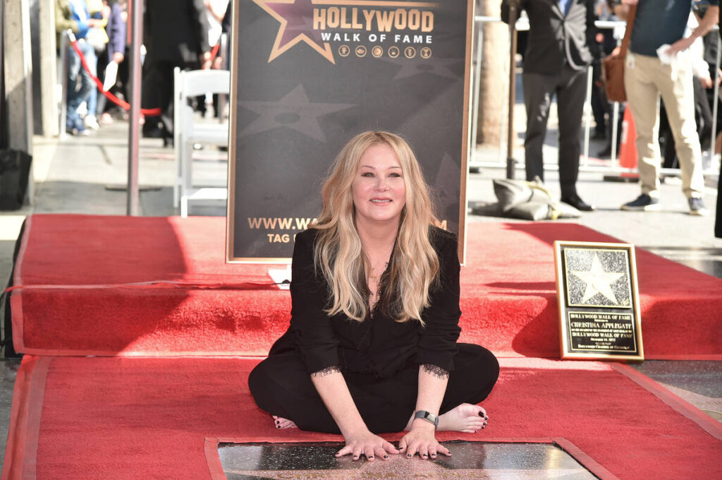Christina Applegate poses at a ceremony honoring her with a star on the Hollywood Walk of Fame ...