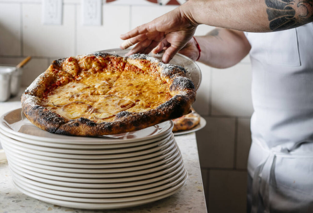 A pie with a bubbling blistered cornice from Che Fico, the San Francisco pizzeria that is poppi ...
