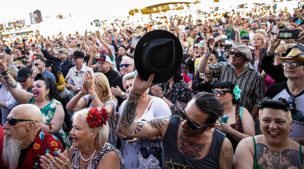 Attendees listen to Big Sandy & His Fly-Rite Boys during the Rockabilly Car Show at Viva La ...