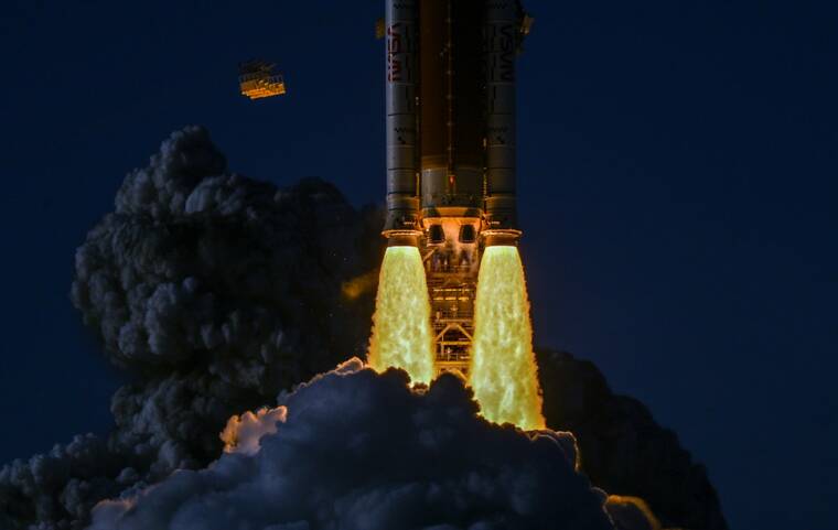 KENNY HOLSTON/THE NEW YORK TIMES
                                Artemis IIs solid rocket boosters are providing the 7.2 million pounds of thrust during launch at Cape Canaveral, Fla., on Wednesday. The crew of Artemis II, three Americans and a Canadian, is the first group of humans to travel to the moon in more than 50 years. They will not land on the surface, but the mission will pave the way for future visits.