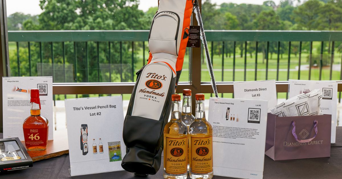 silent auction prizes lined up on a table