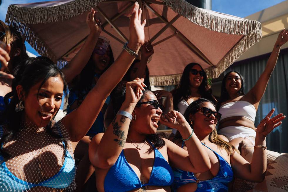 Patrons dance at the newly remodeled Marquee Dayclub at the Cosmopolitan Friday, March 13, 2026 ...