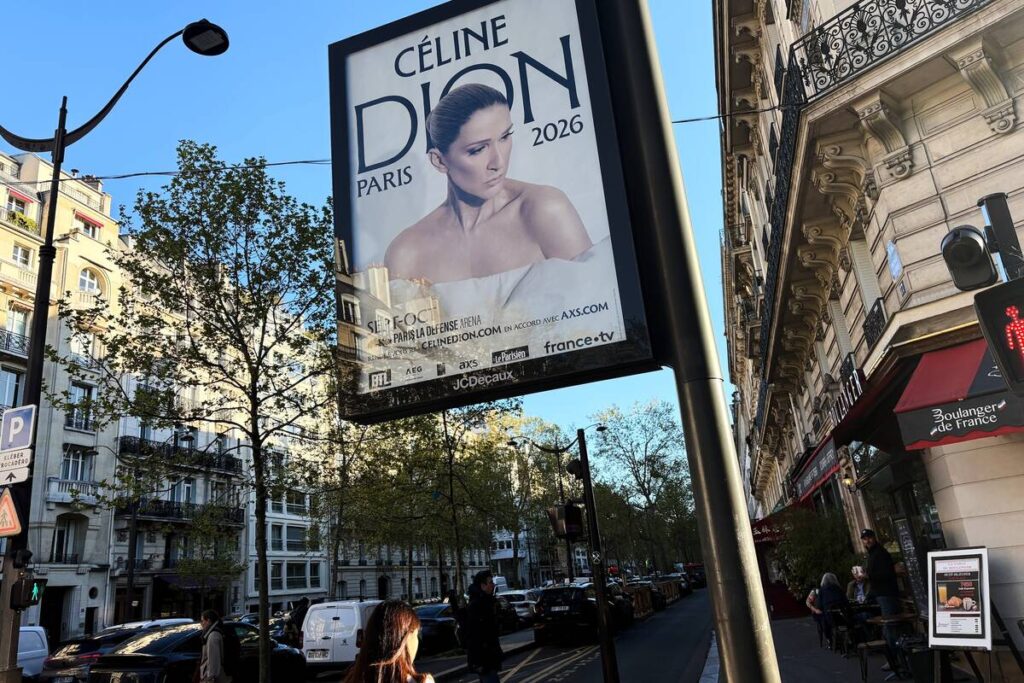 A poster of Celine Dion promoting her autumn concerts is pictured in Paris, France, Tuesday, Ap ...