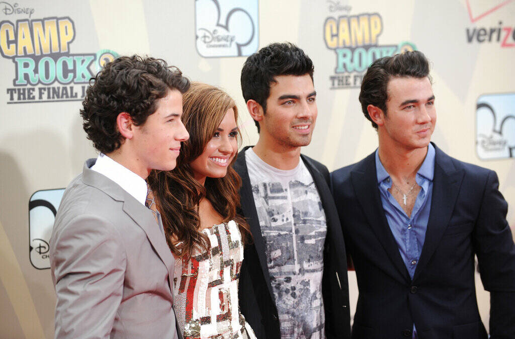 Cast members, from left, Nick Jonas, Demi Lovato, Joe Jonas and Kevin Jonas attend the premiere ...