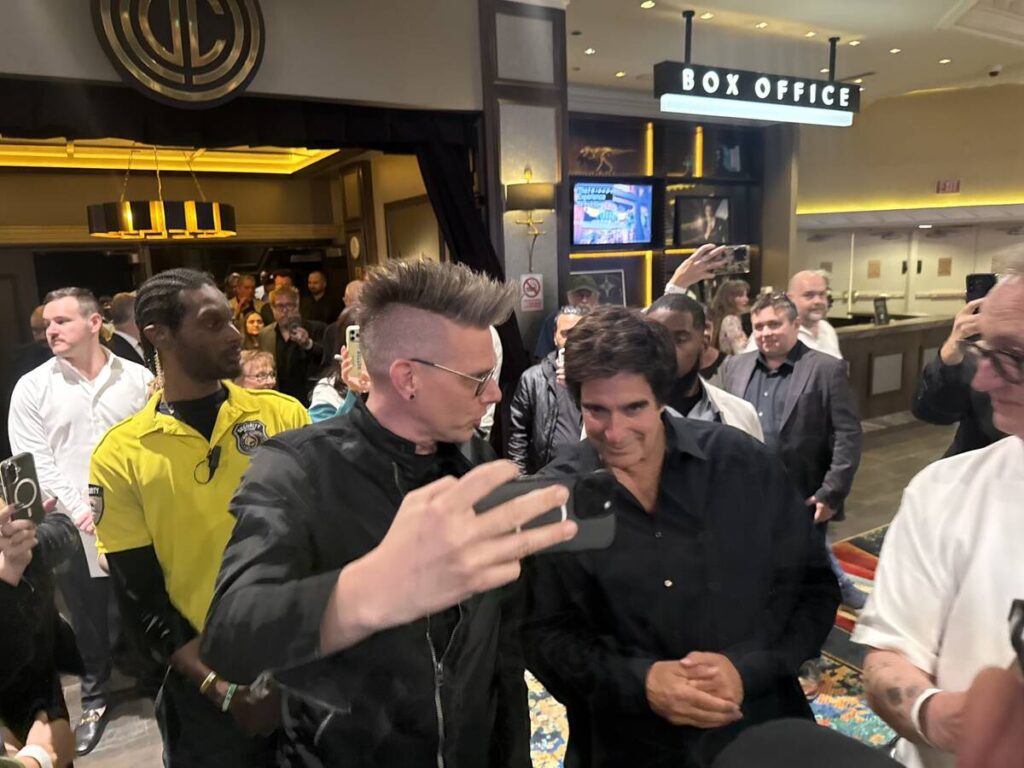 David Copperfield poses for a selfie with magician Chris Funk at the close of Copperfield's sho ...