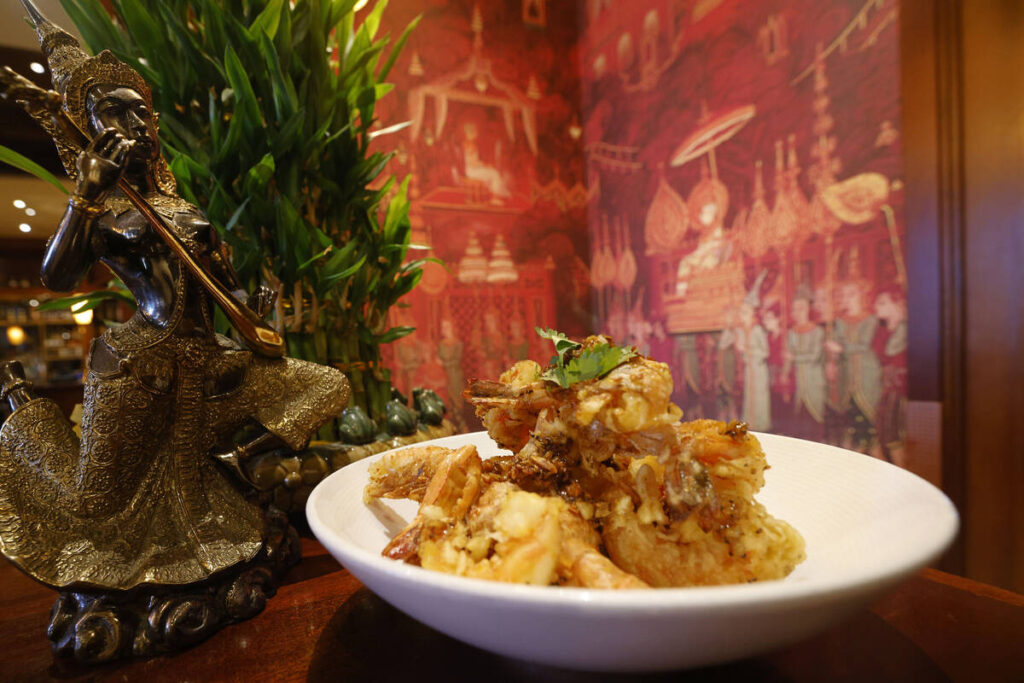 Crisp garlic prawns is a signature dish at Lotus of Siam, which is reopening a location in its ...