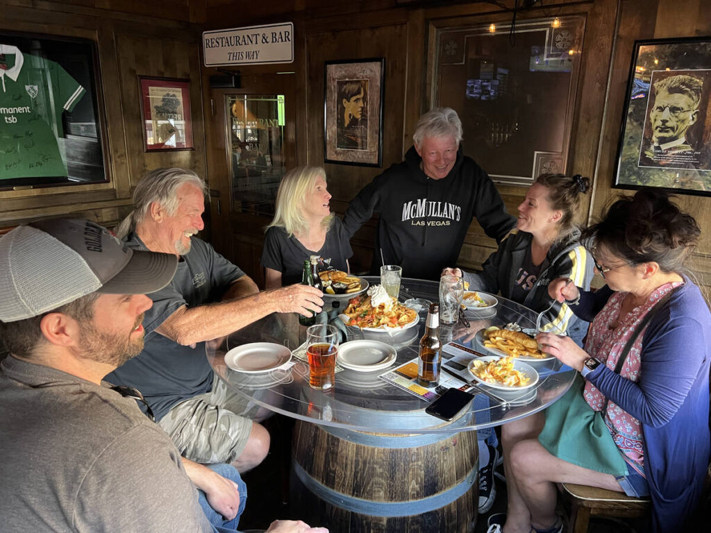 Brian McMullan, standing, owner of McMullan’s Irish Pub in Las Vegas, visits with guests ...