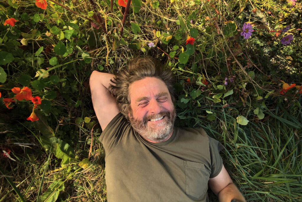 This image released by Netflix shows Zach Galifianakis from his gardening series "This Is ...
