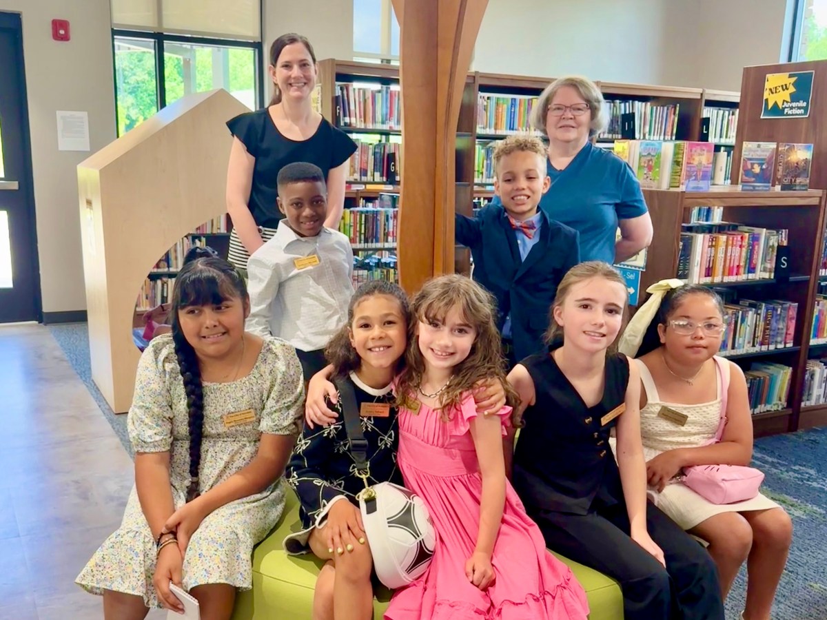 Win big prizes just by reading at Irondale Public Library this summer—it's free + fun 4 Children browsing shelves at Irondale Public Library Irondale Public Library offers books and more for kids and parents. (City of Irondale)