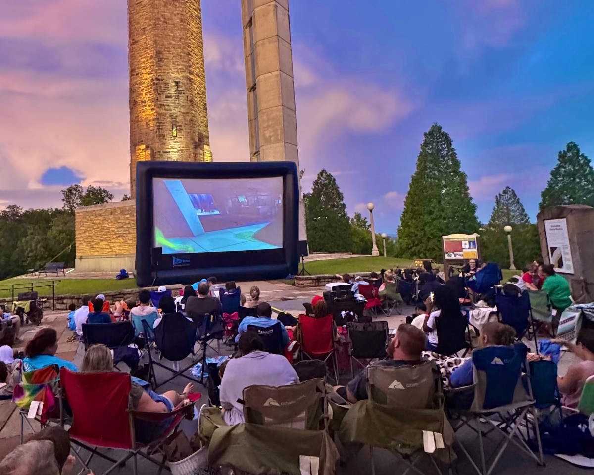 Summer movies: 6 places to watch in Birmingham 4 crowd watching outdoor movie against sunset