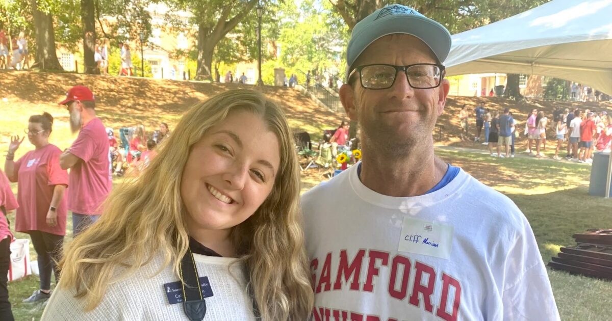 24 weekend events including Juneteenth + Father's Day celebrations (June 19-21) 4 A young woman and an older man smile together at an outdoor event, with a crowd gathered on a sunny lawn behind them