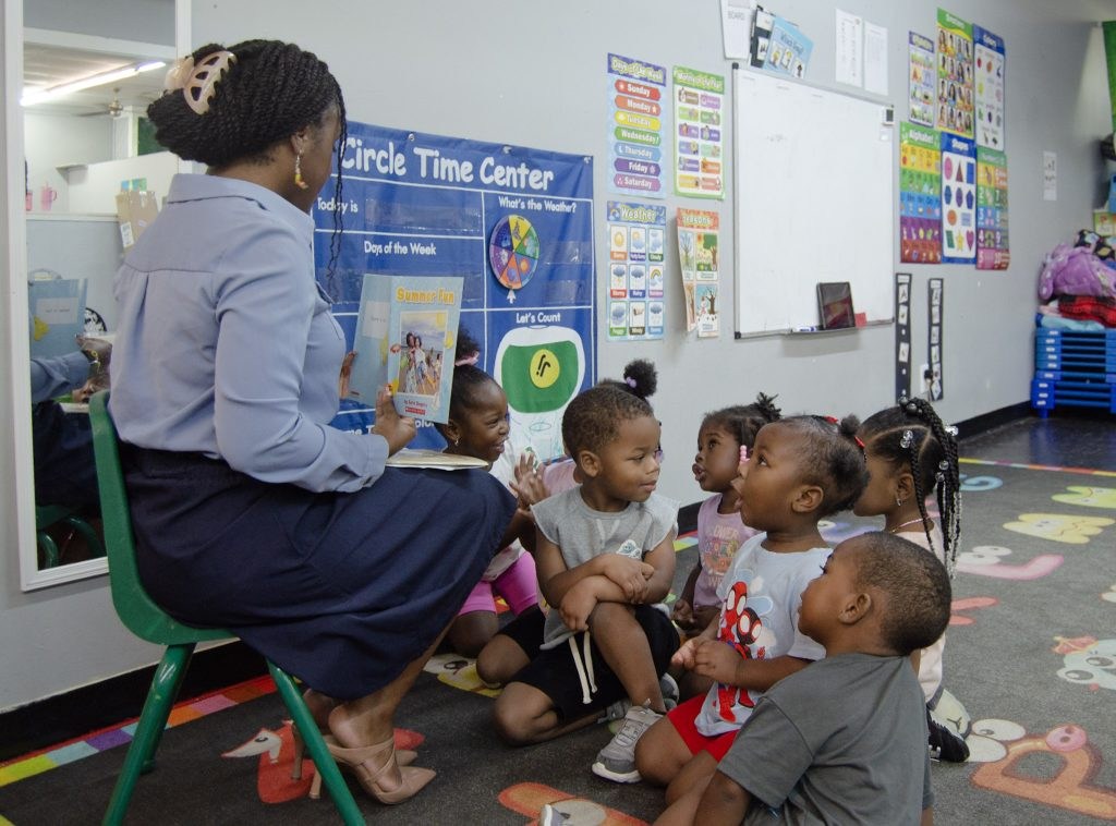 Teacher reading to UWCA EXCEL programs