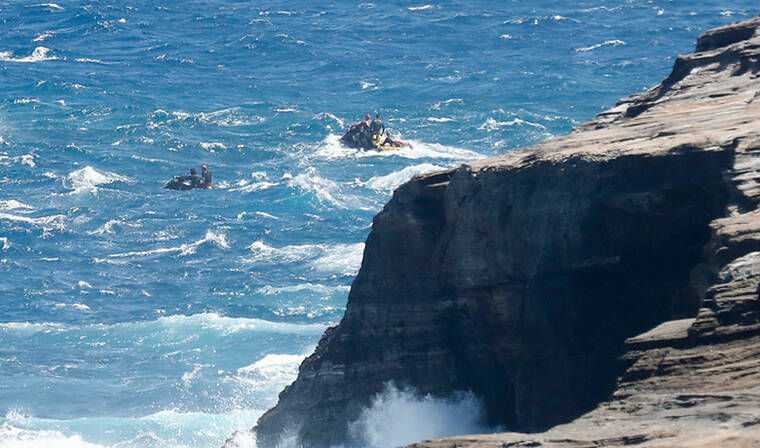 JAMM AQUINO / JAQUINO@STARADVERTISER.COM
                                A multi-agency search for a South Korean man and his teenage son who went missing from Hanauma Bay Ridge Trail on Tuesday ended today after four days without any sign of the pair. Shown here, search crews scour the water off Hanauma on Thursday.