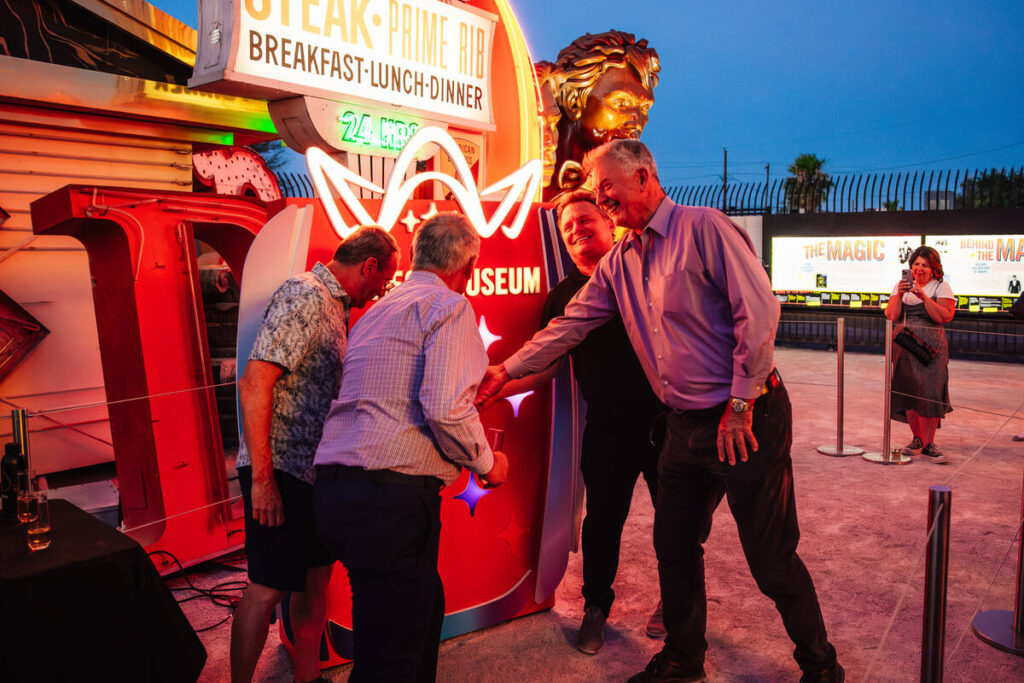 A light switch is turned on during a lighting ceremony for the Mirage Lagoon sign and a Volcano ...