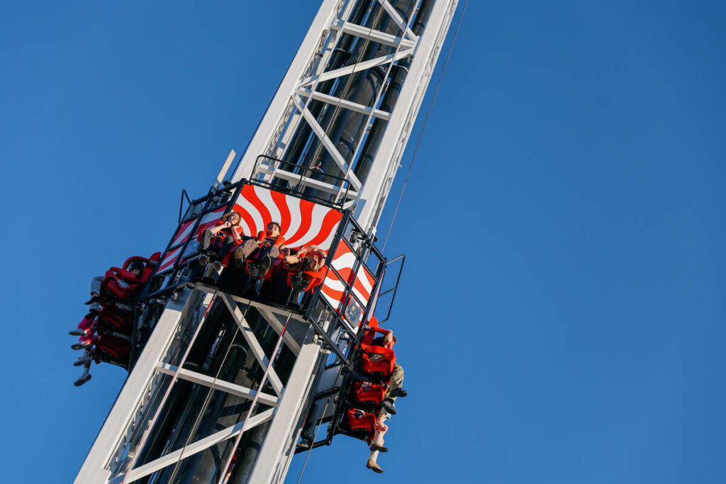 Guests ride the Eye Dropper during the opening celebration for the new ride on Saturday, June 2 ...