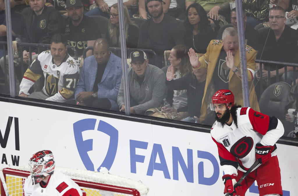 Athletics owner John Fisher, center left in grey, watches the game alongside casino owner Derek ...