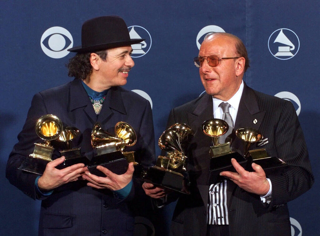 Carlos Santana, left, and producer Clive Davis pose with their Grammys at the 42nd Grammy Award ...