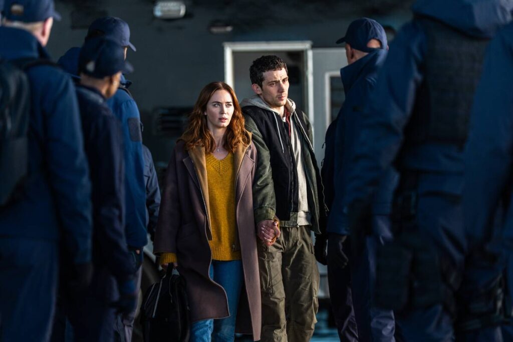 This image released by Universal Pictures shows Emily Blunt, left, and Josh O'Connor in a ...