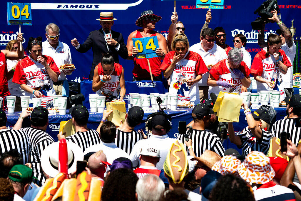 Women compete in the Nathan’s Famous Fourth of July hot dog eating contest in Coney Isla ...