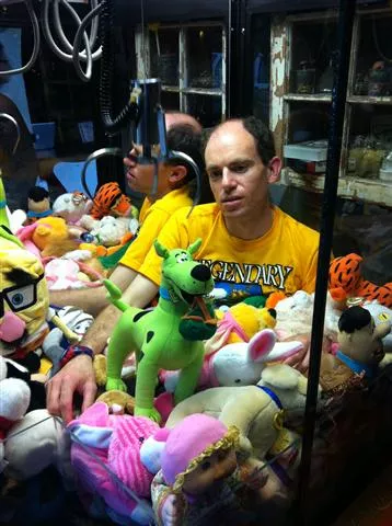 Performance artist Brian Feldman plans to spend the day in a skill-crane machine at Stardust Video