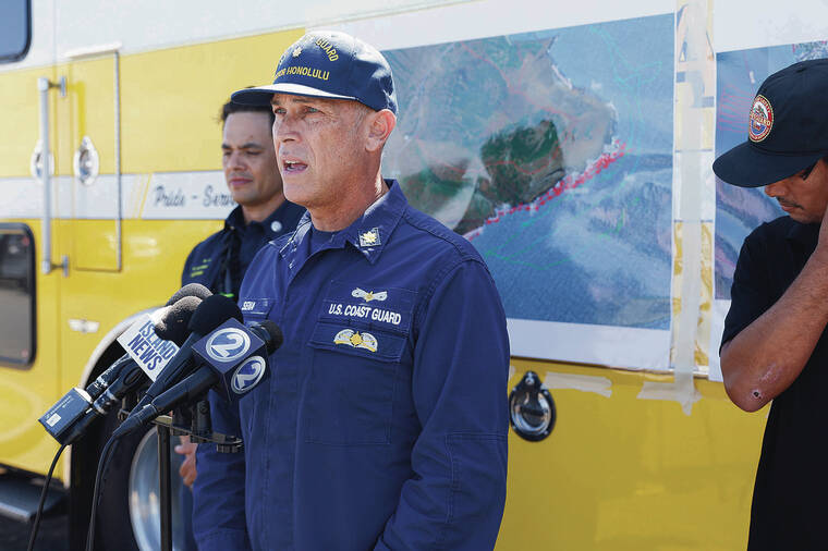 JAMM AQUINO / JAQUINO@STARADVERTISER.COM
                                U.S. Coast Guard Lt. Cmdr. Chris Sena speaks Thursday at Sandy Beach news conference about the search for a missing father and his teenage son who went missing off Hanauma Bay on Tuesday. The search was suspended at sunset today