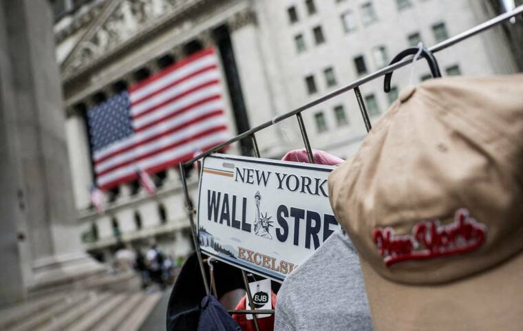 Wall Street sinks on bets Fed will hike rates this year