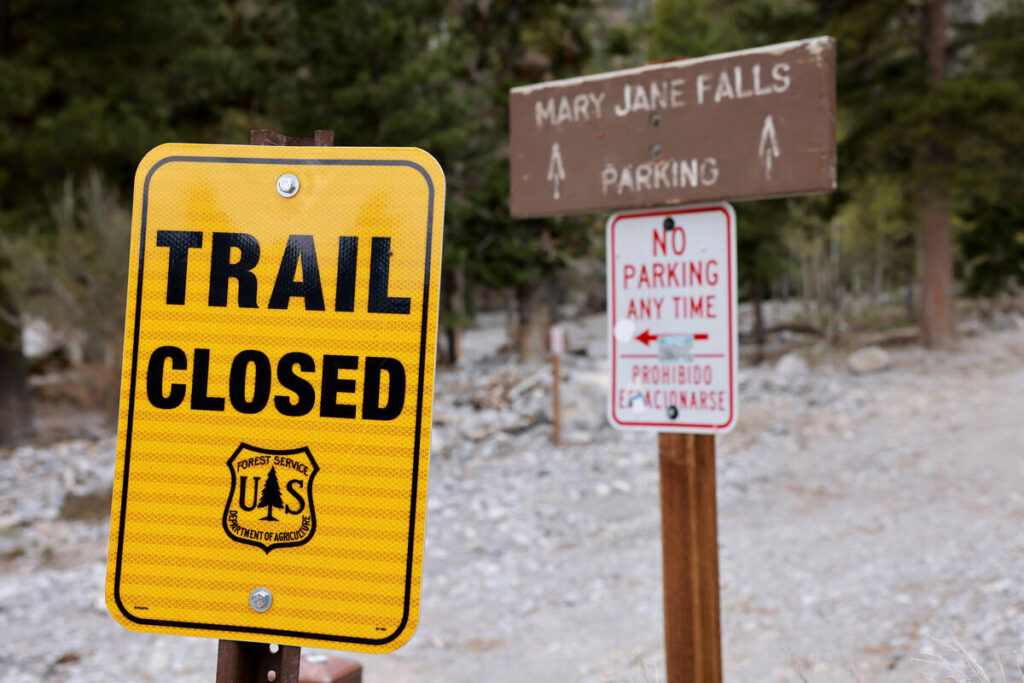 A U.S. Forest Service sign announces the Mary Jane Falls trail is closed in the Spring Mountain ...