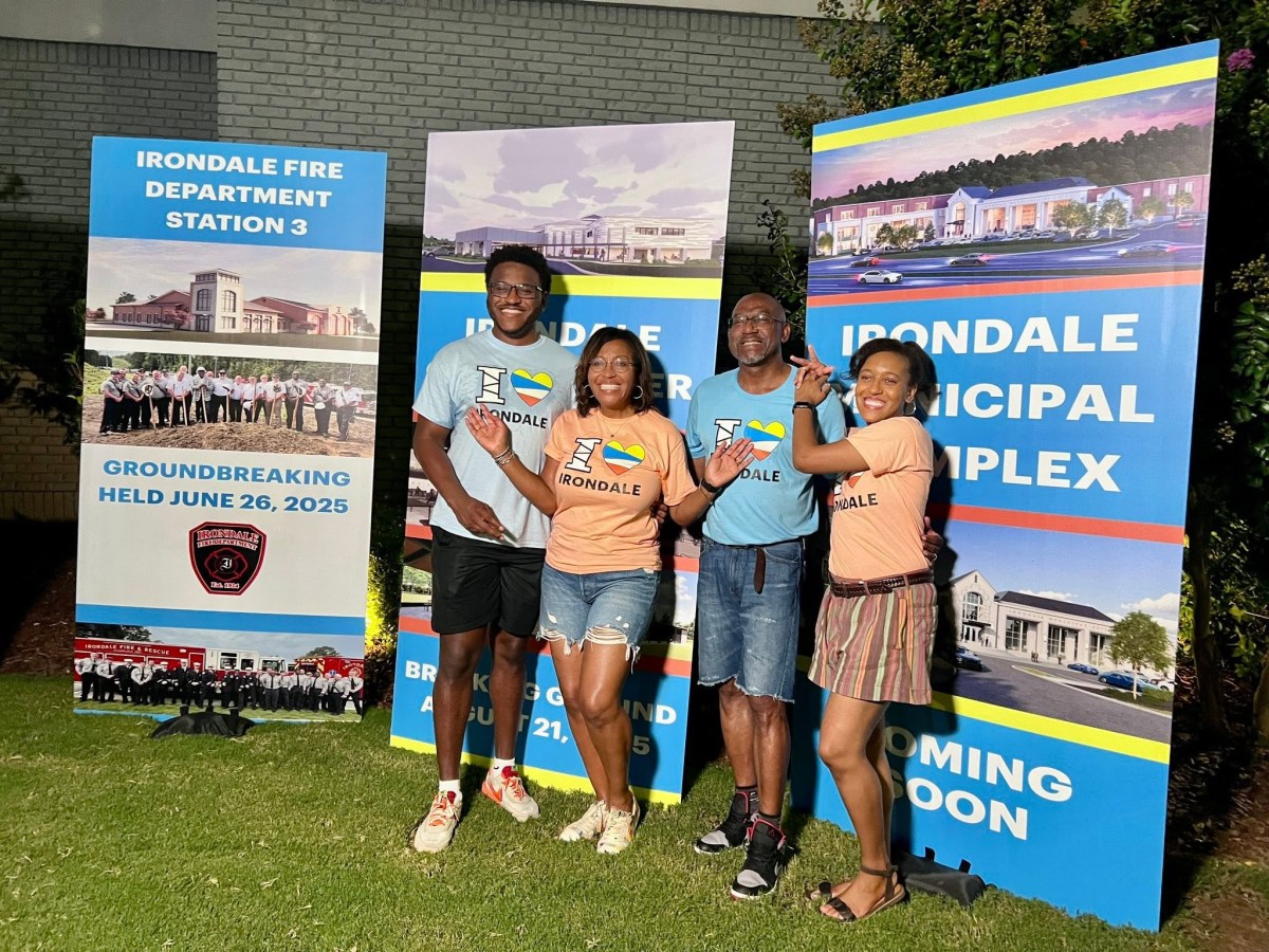 FREE I Love Irondale Day 2026 brings food, fun + tech 2 Mayor James D. Stewart Jr. and three others in I Love Irondale shirts pose in front of Irondale city development banners