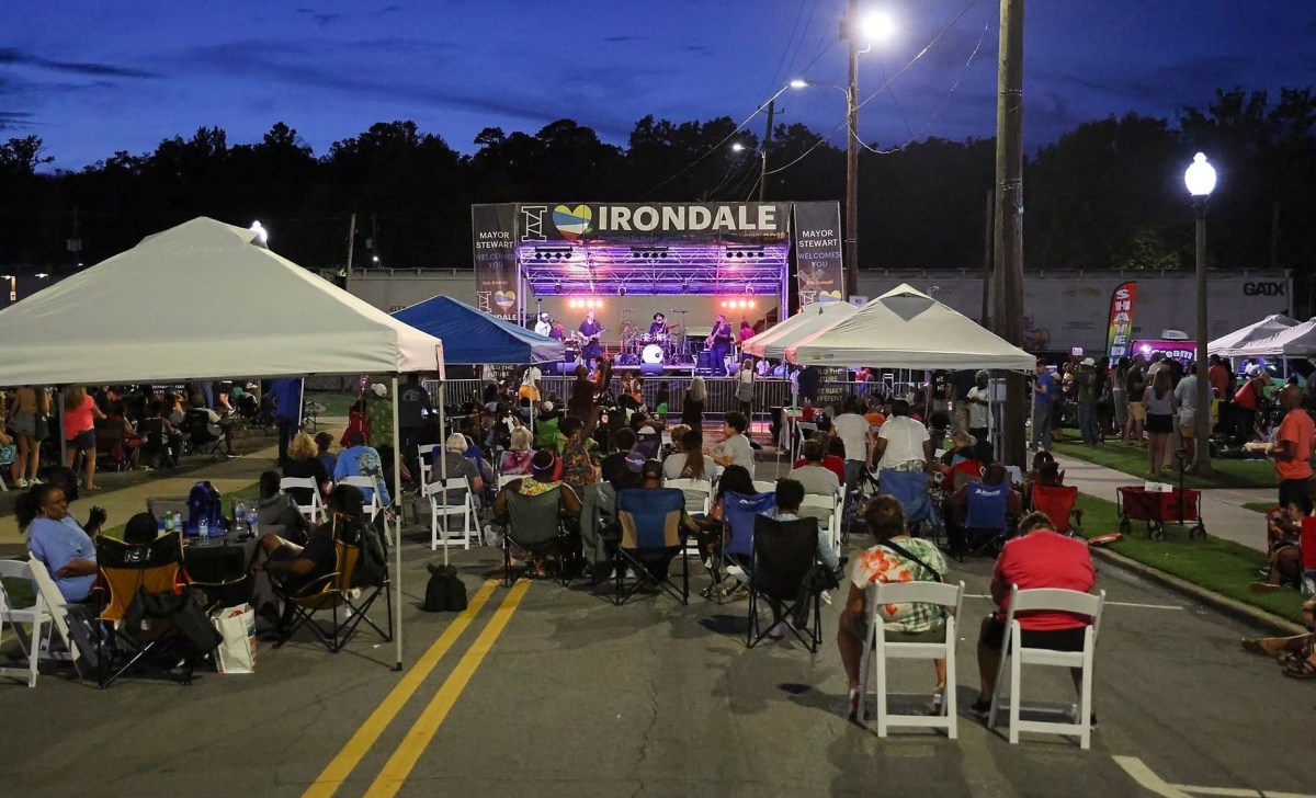 FREE I Love Irondale Day 2026 brings food, fun + tech 4 Crowd seated in chairs and under canopy tents watching a live band perform on an I Love Irondale stage at dusk