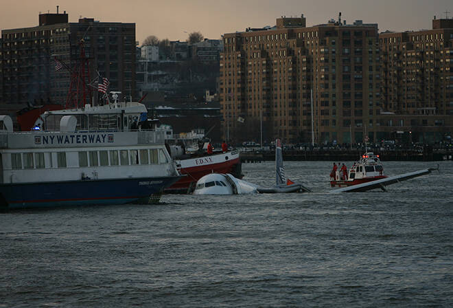 MICHAEL APPLETON / NEW YORK TIMES / JAN. 15, 2009
                                A US Airways jetliner is accompanied by emergency craft and a civilian ferry as it floats down New Yorks Hudson River in 2009. All 155 people aboard a US Airways flight survived when pilot Chesley Sully Sullenberger landed the plane in the river after it hit a flock of geese. Sullenberger announced today that he has been diagnosed with Alzheimers disease.