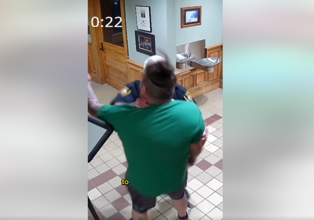 N.H. police chief seen on video grabbing man by throat inside police station