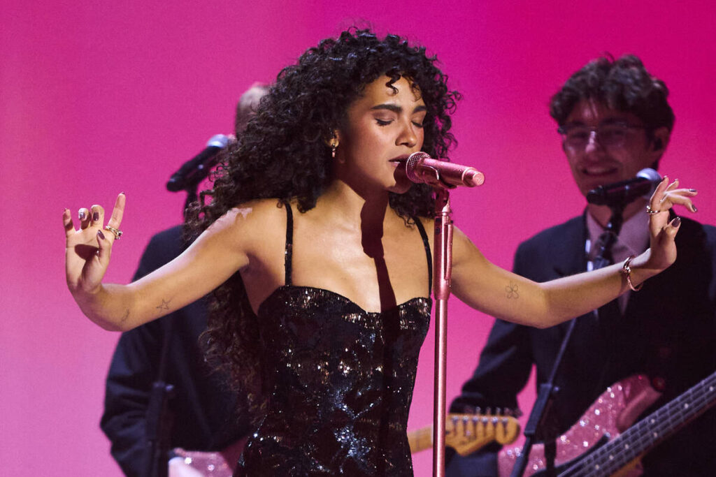 Olivia Dean performs during the Brit Awards 2026 in Manchester, England, Saturday, Feb. 28, 202 ...
