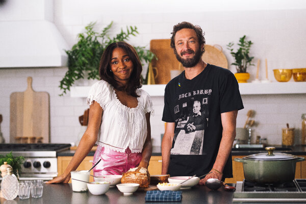 Ayo Edebiri, left, and Ebon Moss-Bachrach at a kitchen counter.