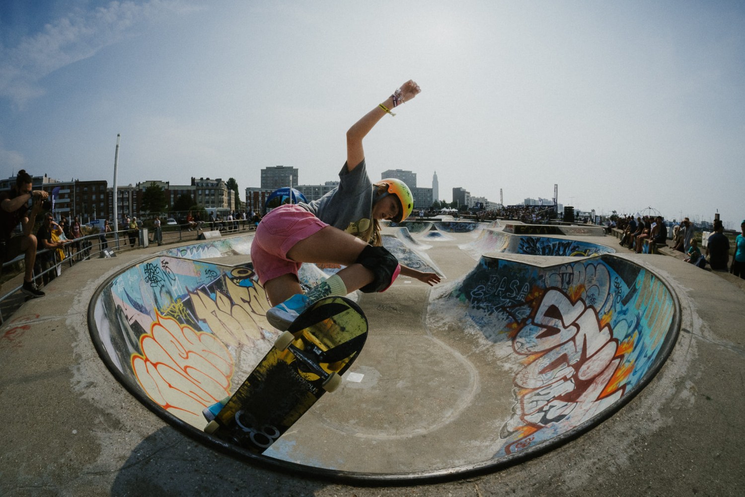 The world's biggest action sports festival is coming to Birmingham—how to win VIP tickets 5 Skateboarder in a helmet and pink shorts performs a trick on the lip of a graffiti-covered concrete bowl at an outdoor skate park
