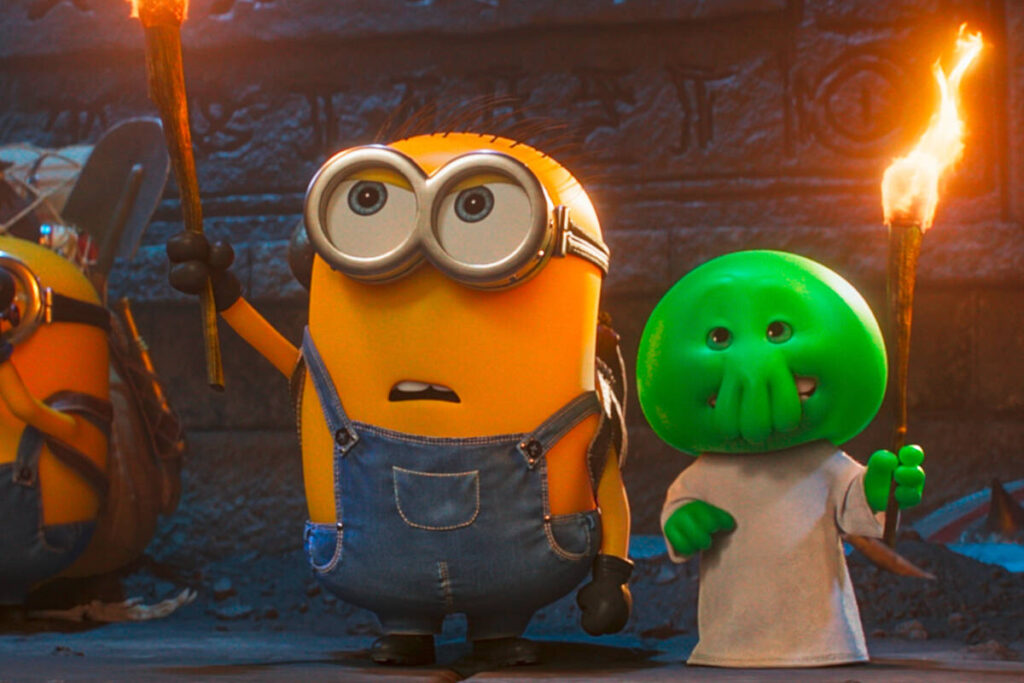 This image released by Universal Pictures shows minion Henry, voiced by Pierre Coffin, left, an ...