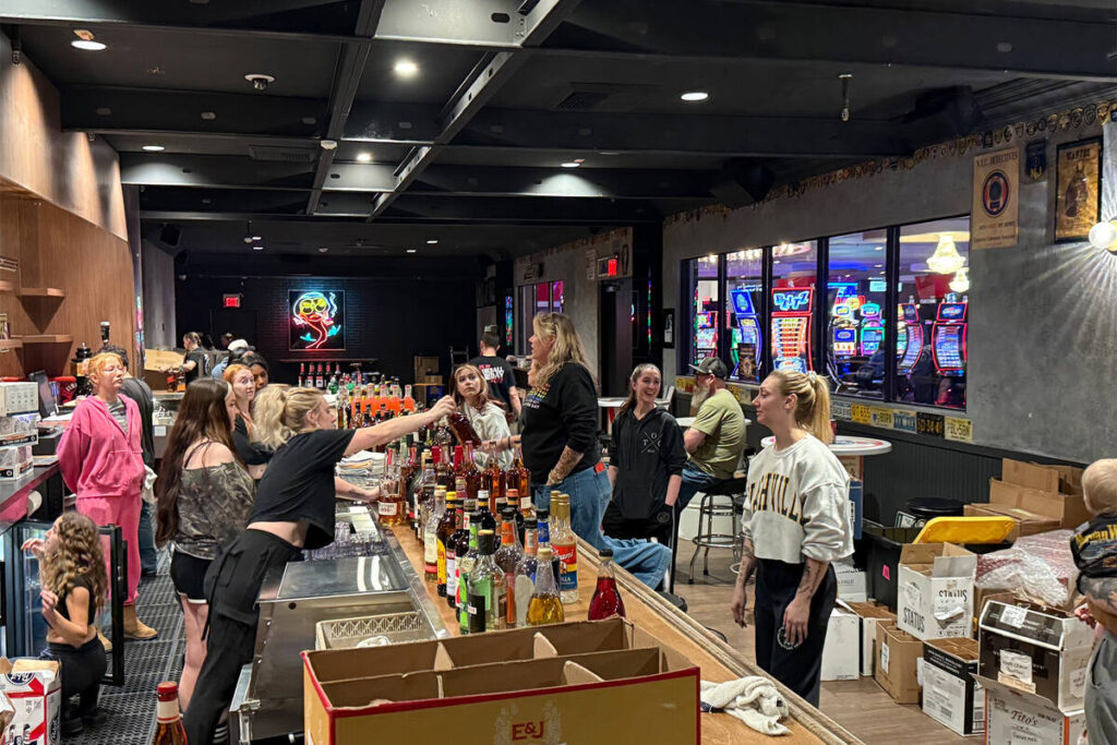 Hogs & Heifers COO Michelle Sandler holds an impromptu meeting with staff at the pop-up Hogs & ...