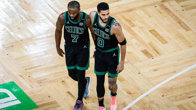 Jaylen Brown puts his arm around Jayson Tatum during the 2024 NBA Finals.